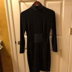 Black Frank Lyman long sleeved body con dress with detailing at neck and waist
